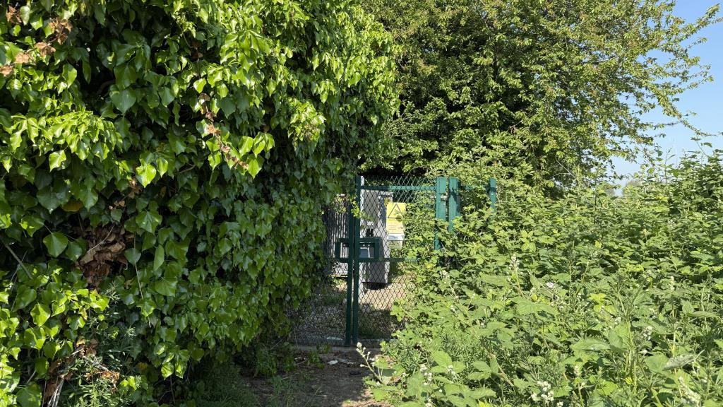 Lot: 68 - LAND WITH POTENTIAL - External image of rear of site and sub-station